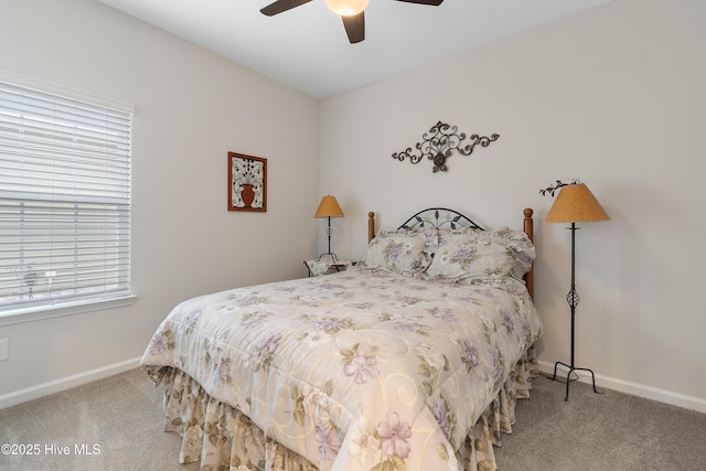 carpeted bedroom with multiple windows and ceiling fan