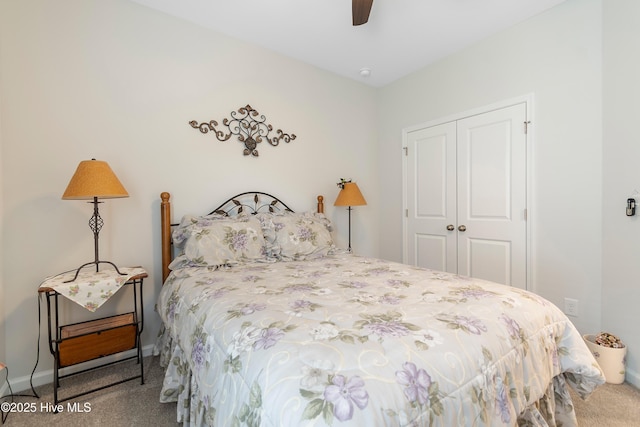 bedroom featuring ceiling fan, a closet, and carpet