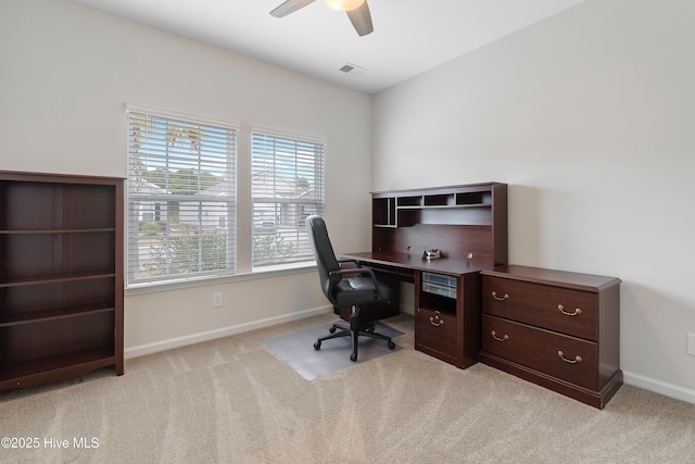 carpeted office featuring ceiling fan