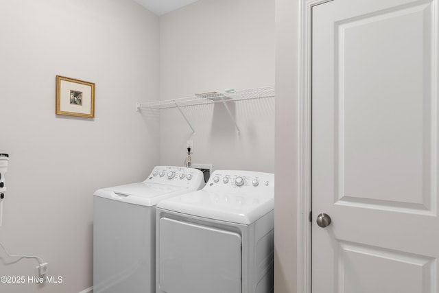 laundry area featuring washing machine and dryer