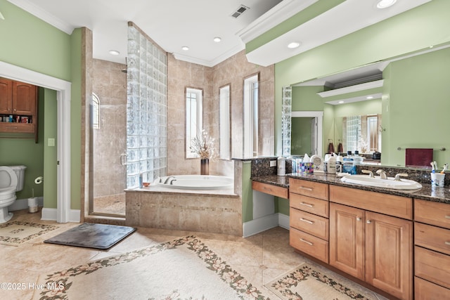 bathroom with tile patterned floors, ornamental molding, separate shower and tub, and vanity