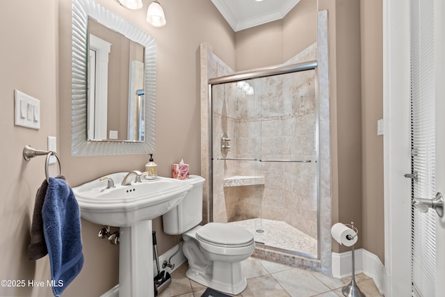 bathroom featuring sink, tile patterned flooring, toilet, an enclosed shower, and crown molding