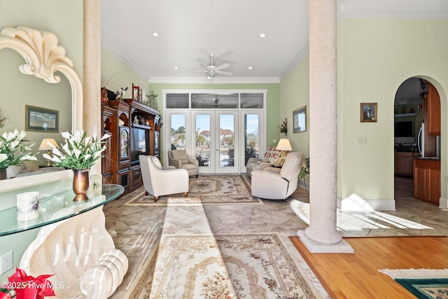 living room featuring french doors, ceiling fan, light hardwood / wood-style floors, and crown molding