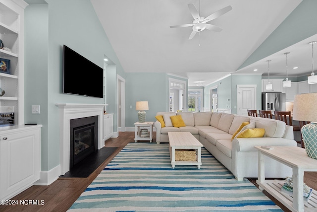 living room featuring ceiling fan, built in features, dark hardwood / wood-style flooring, and lofted ceiling