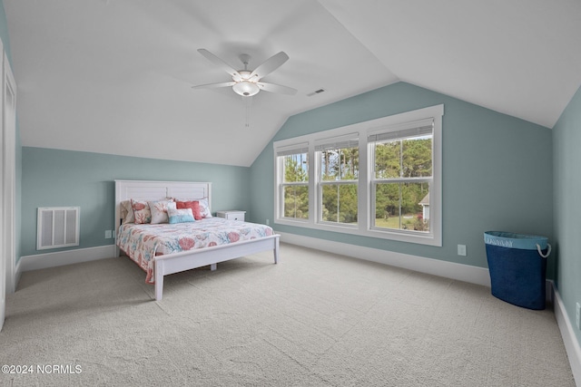 bedroom featuring ceiling fan, carpet floors, and vaulted ceiling