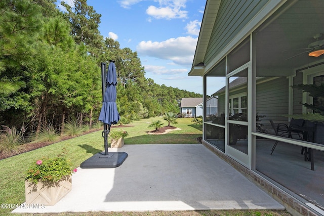 view of patio / terrace with a sunroom