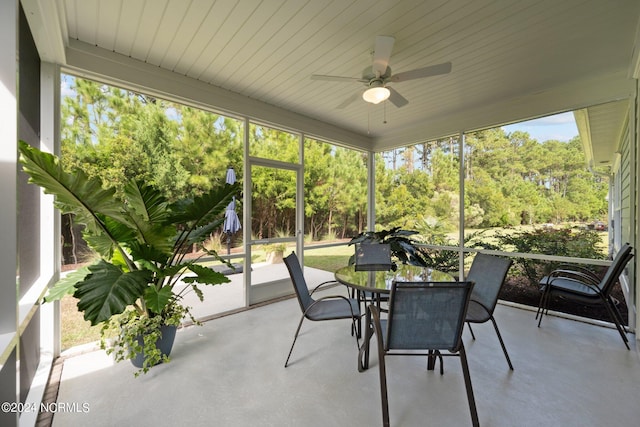 sunroom / solarium with ceiling fan and plenty of natural light