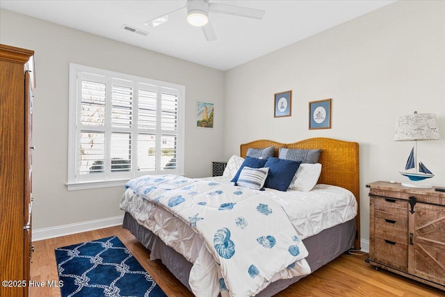 bedroom featuring ceiling fan and wood-type flooring