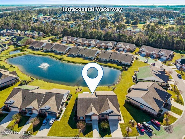 aerial view featuring a water view and a residential view