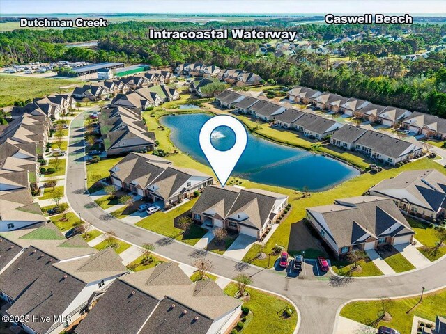 drone / aerial view with a residential view and a water view