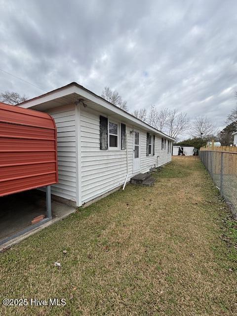 view of property exterior with a yard