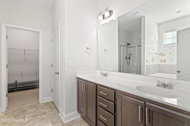 bathroom with vanity and walk in shower