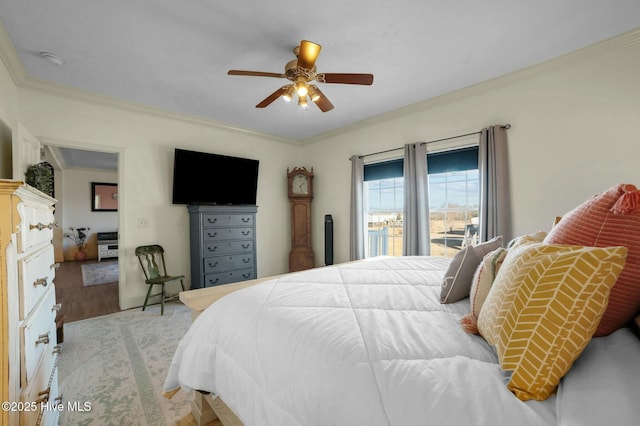 bedroom with crown molding and ceiling fan