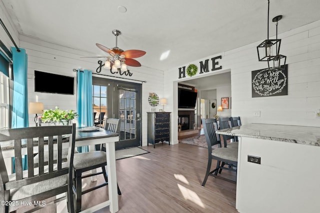 dining area featuring hardwood / wood-style flooring and ceiling fan