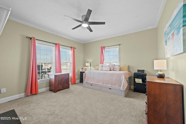 carpeted bedroom featuring ornamental molding and ceiling fan