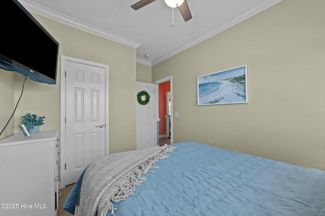 bedroom with ornamental molding and ceiling fan