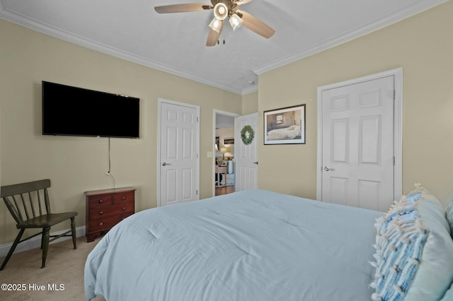 carpeted bedroom with crown molding and ceiling fan