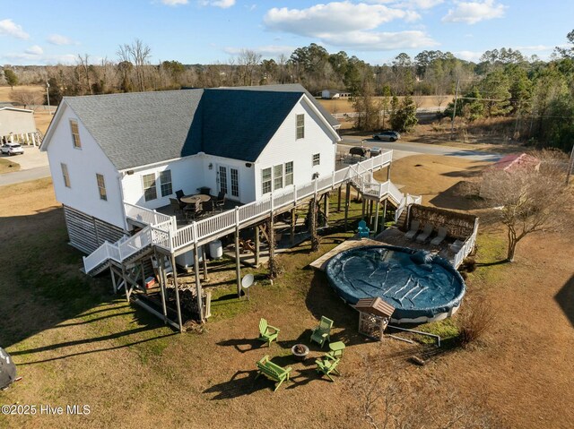 rear view of house with a yard