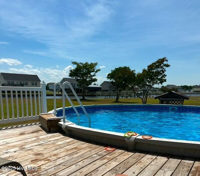 view of pool with a wooden deck