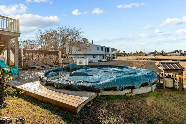 deck with a covered pool