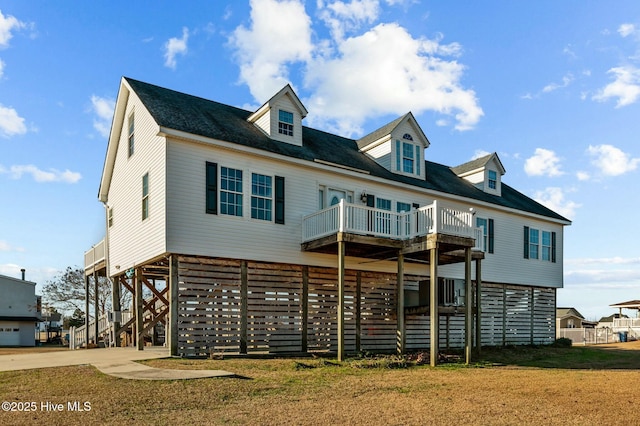 view of front facade with a carport and a front lawn