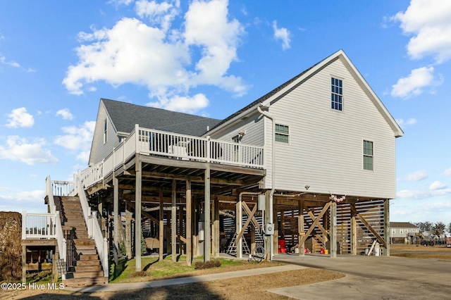 back of property featuring a carport