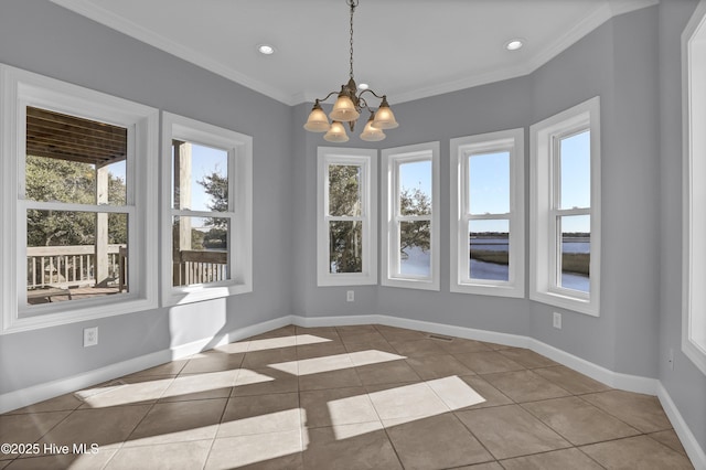 unfurnished dining area with a notable chandelier, light tile patterned floors, and crown molding