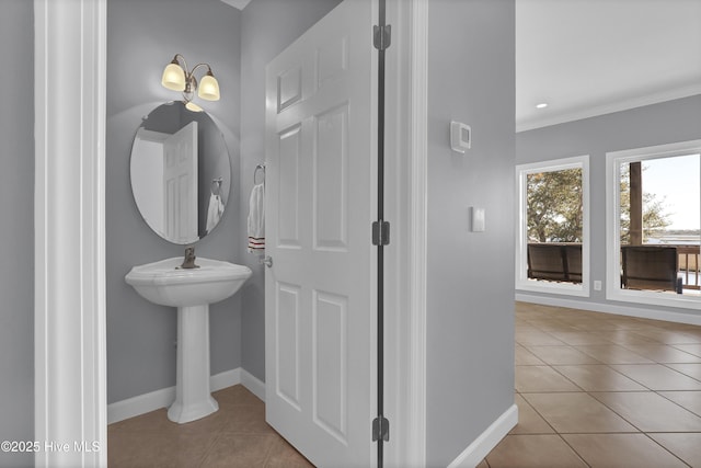 bathroom with tile patterned flooring and ornamental molding