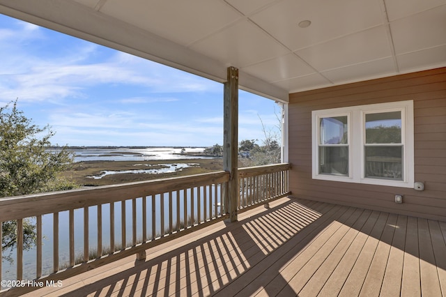 wooden terrace with a water view