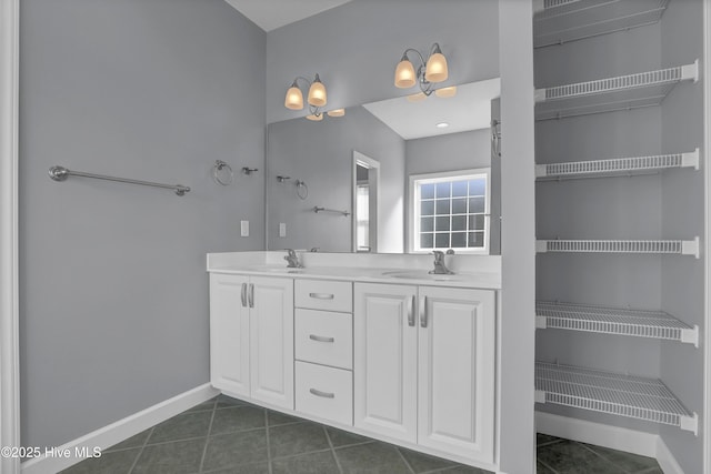 bathroom featuring tile patterned flooring and vanity