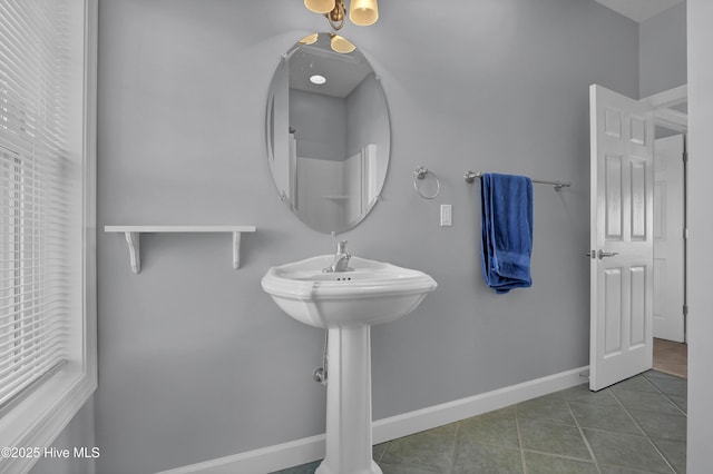 bathroom with tile patterned floors