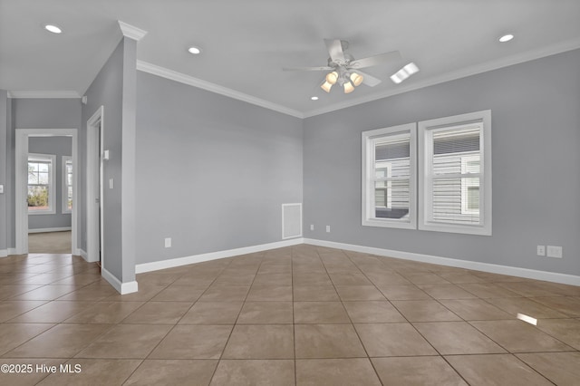 tiled empty room with ceiling fan and ornamental molding