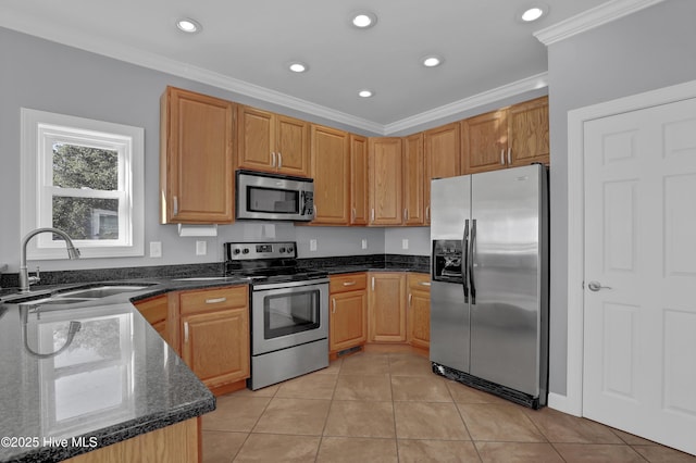 kitchen with light tile patterned floors, stainless steel appliances, ornamental molding, and sink