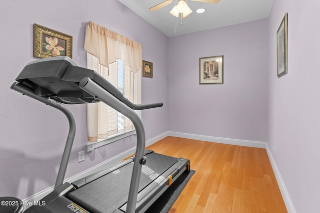 exercise area with hardwood / wood-style flooring, plenty of natural light, and ceiling fan