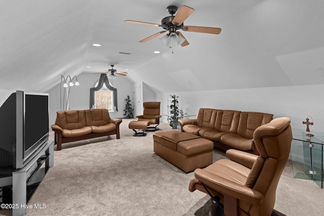 carpeted living room featuring ceiling fan and lofted ceiling