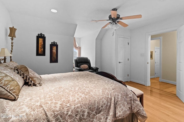 bedroom featuring ceiling fan and light hardwood / wood-style flooring