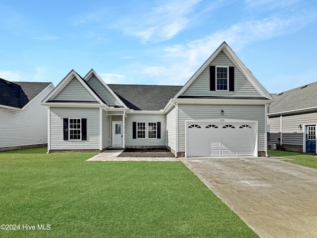 view of front of home featuring a front yard and a garage