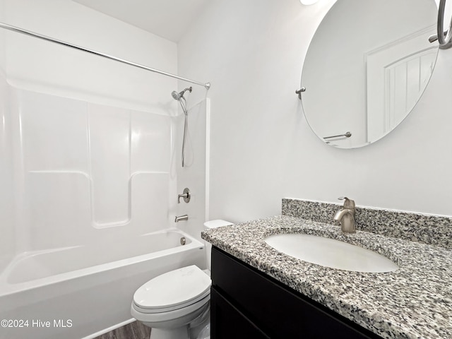 full bathroom with shower / bathing tub combination, vanity, and toilet