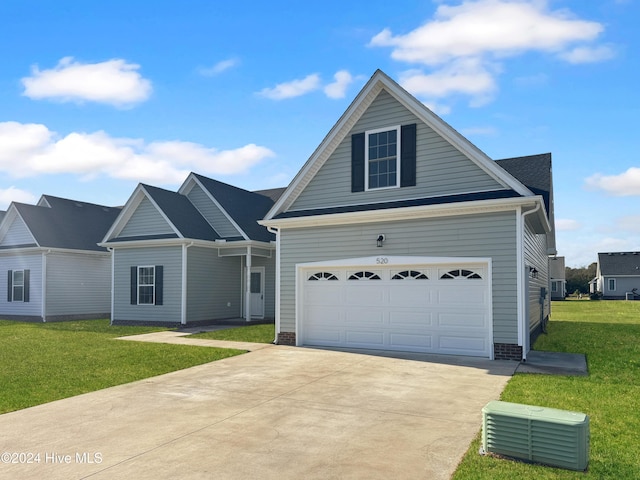 view of front facade with a garage and a front yard