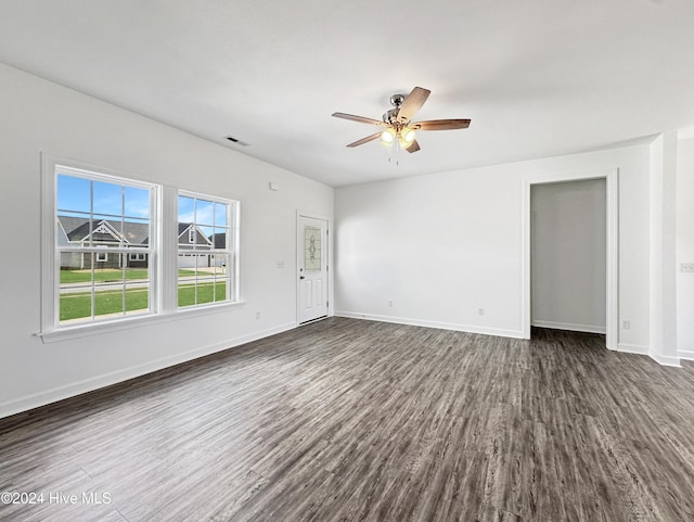 unfurnished room featuring ceiling fan and dark hardwood / wood-style floors