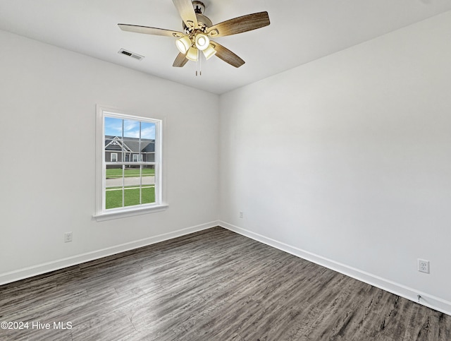 unfurnished room with dark hardwood / wood-style floors and ceiling fan