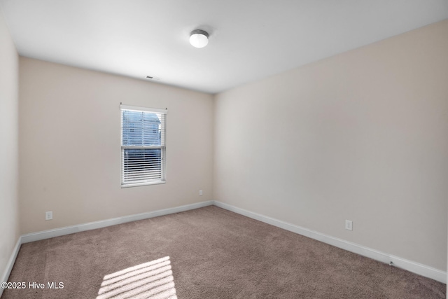 spare room with carpet flooring