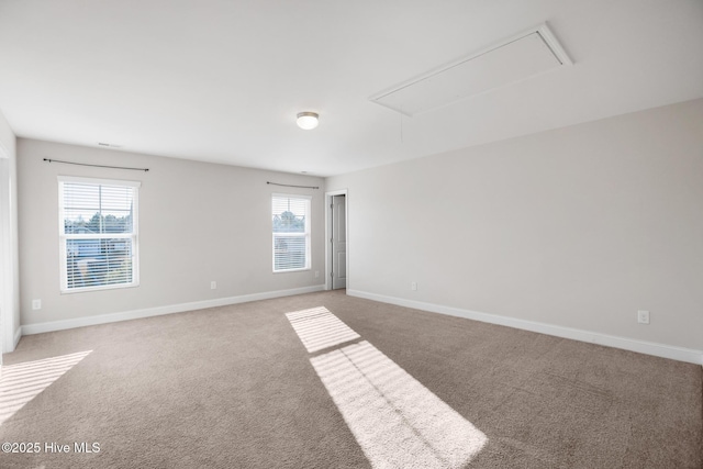 carpeted empty room with plenty of natural light