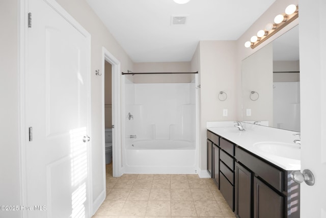 full bathroom featuring vanity, toilet, and shower / washtub combination