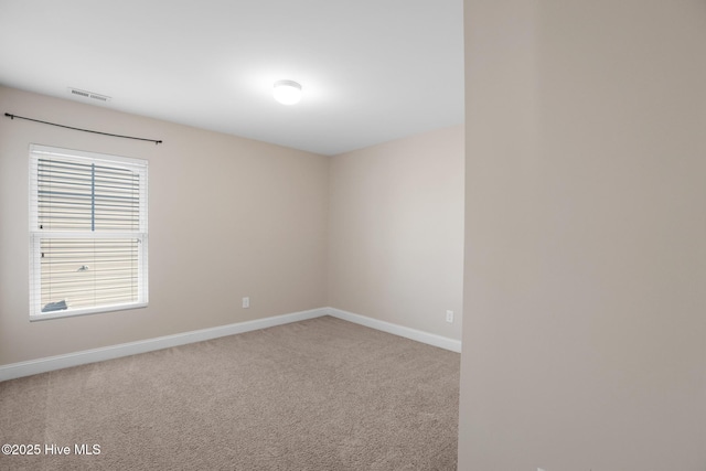 empty room with carpet flooring