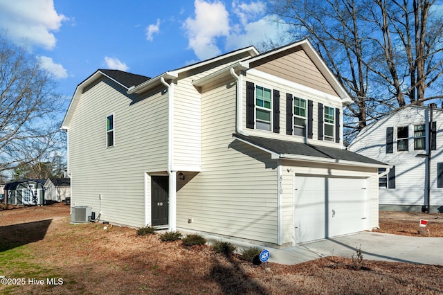 exterior space featuring central AC and a garage