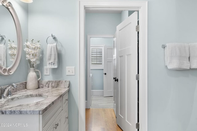 bathroom featuring hardwood / wood-style floors and vanity