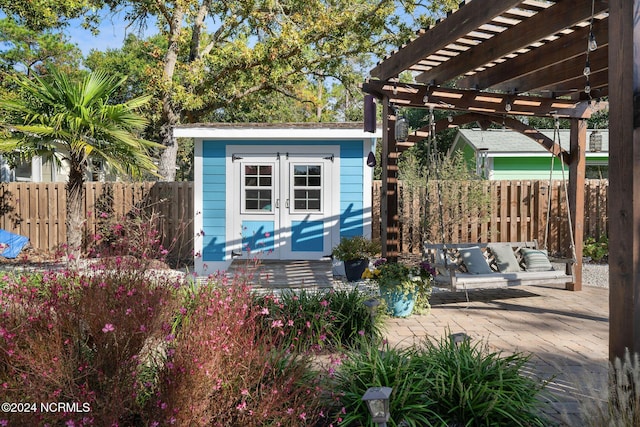 112 NE 28th St, Oak Island, NC 28465 - view of shed with a pergola