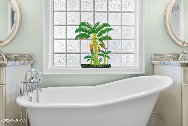 112 NE 28th St, Oak Island, NC 28465 - full bath featuring vanity and a soaking tub