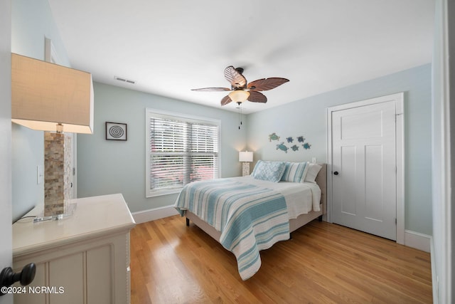 bedroom featuring ceiling fan and light hardwood / wood-style floors